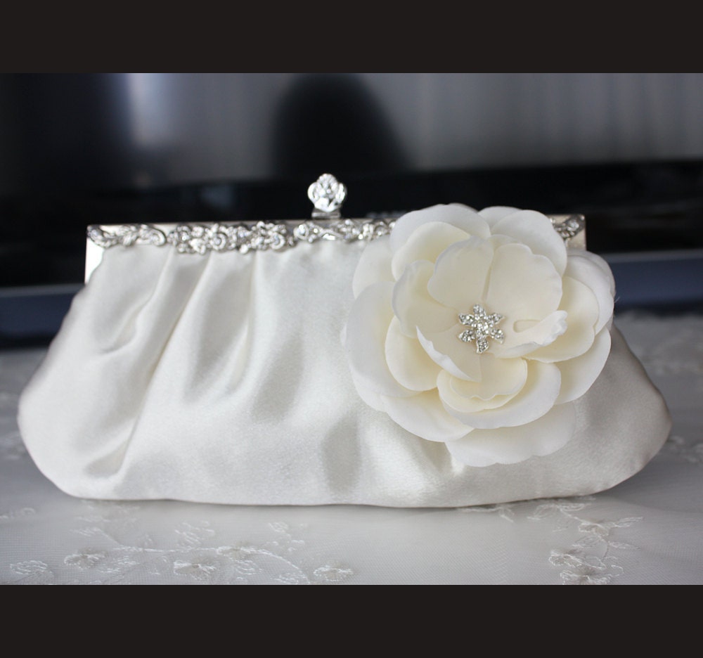 Ivory satin bridal clutch purse with flower