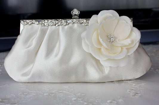 Ivory satin bridal clutch purse with flower