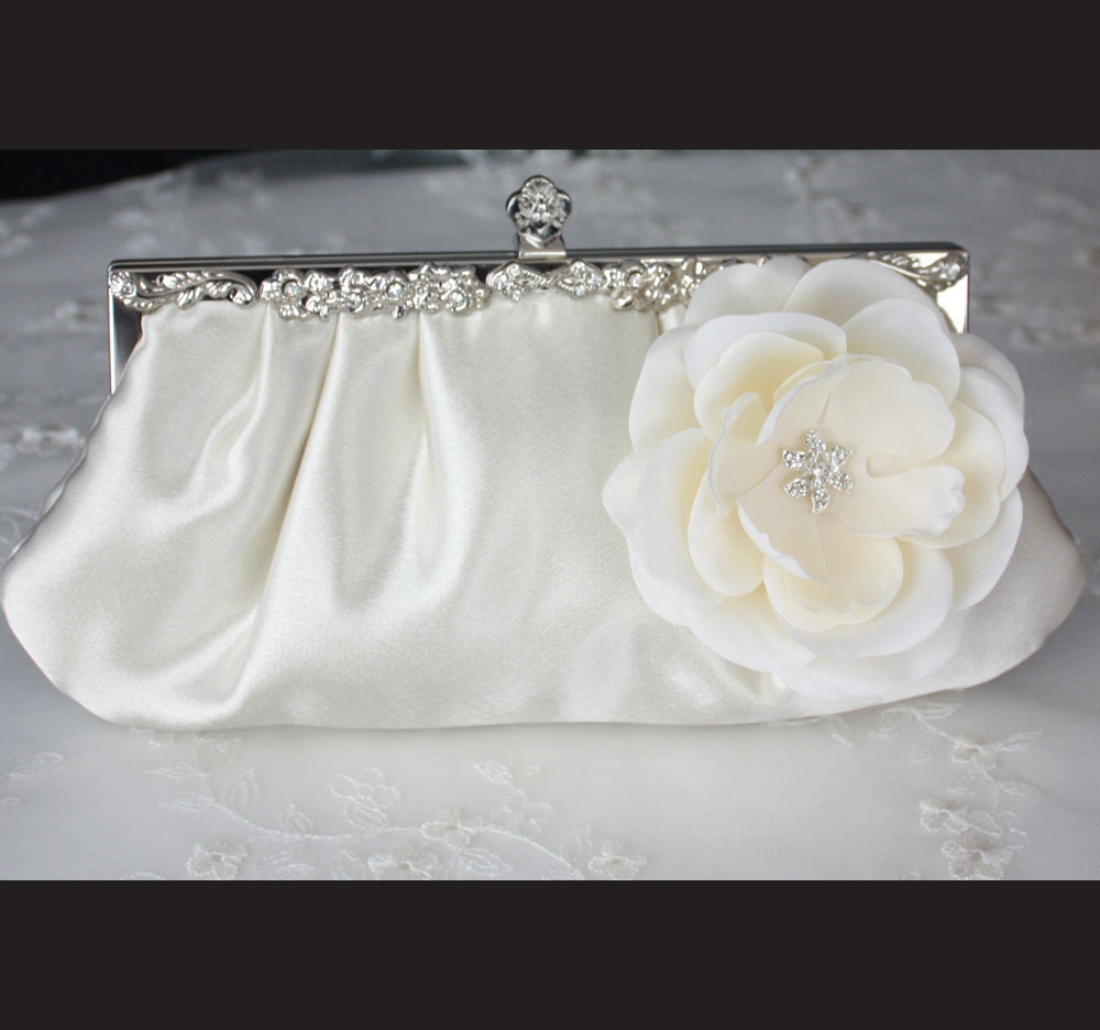 Ivory satin bridal clutch purse with flower